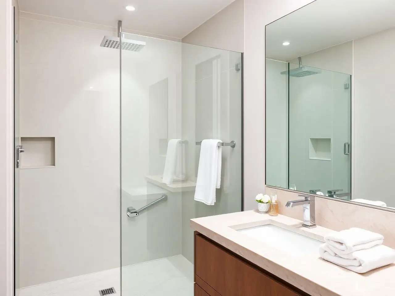 Pristine bathroom with polished glass and stone